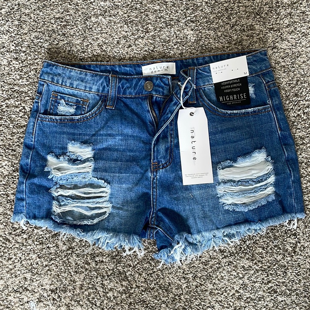 NWT Nature Denim shorts distressed and super cute. Size medium.